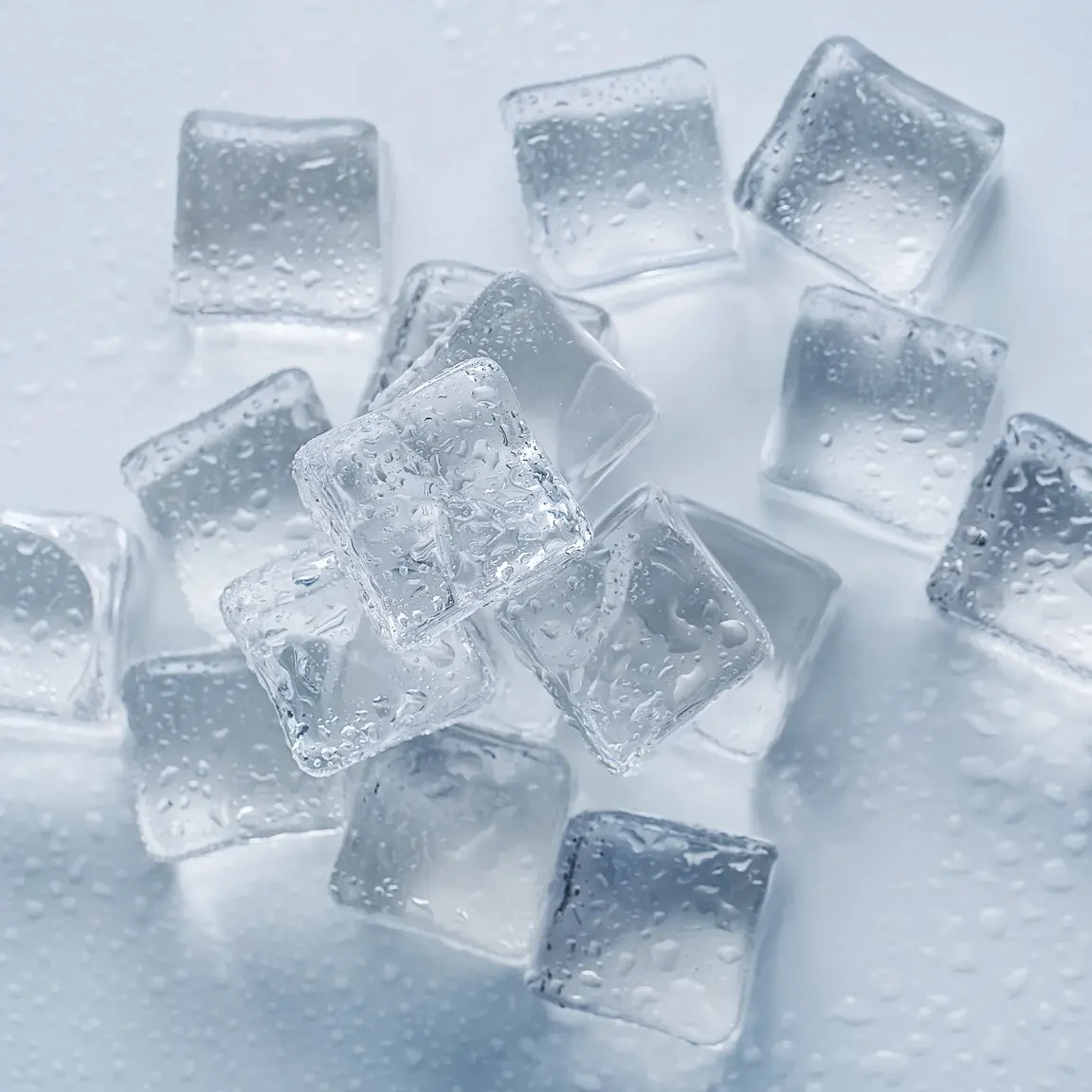 Crystal clear ice cubes on a wet surface - Frost Flare